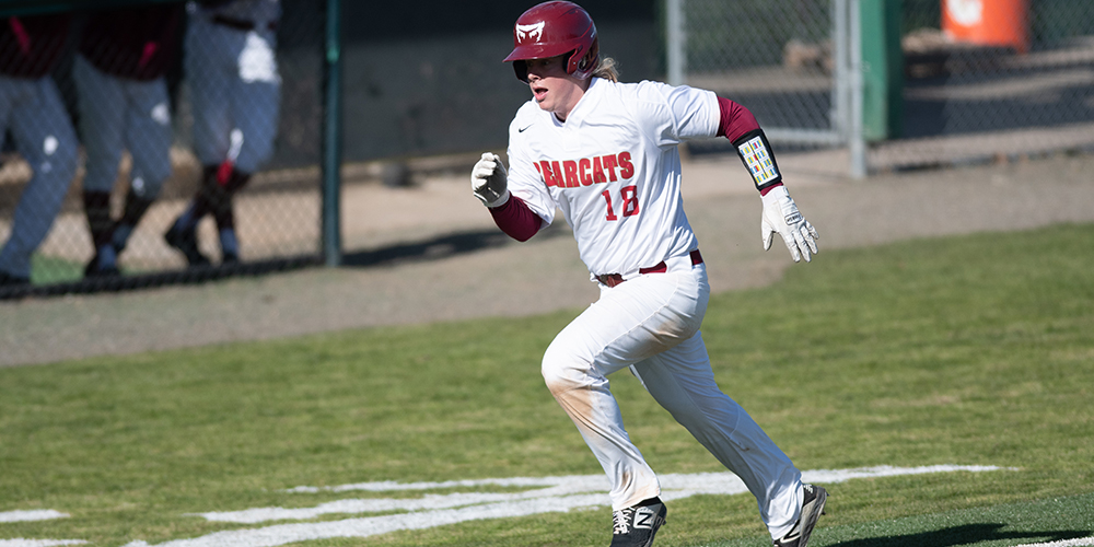 Layton Wagner runs along the third base line toward home plate.