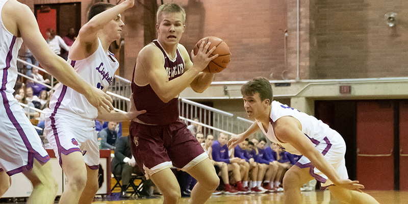 Jonathan Watts controls the ball as he drives into the lane.