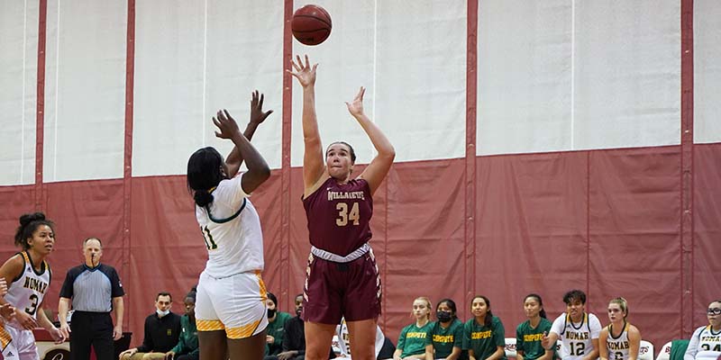 Ashley Collins shoots a jumper over a defender.