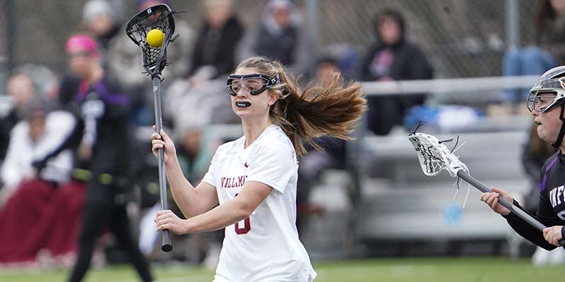 Maddie Garcia holds her stick up while looking for a teammate.