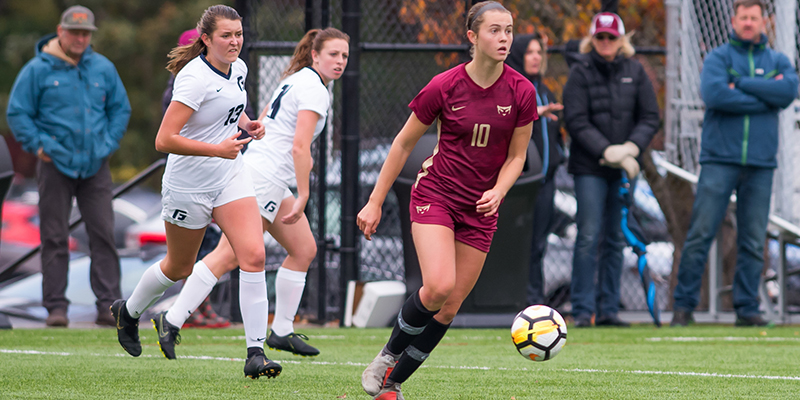 Sydney Wilson controls the ball as she looks for a teammate who can receive a pass.